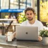 Apple-Macbook-Pro-16-Inch-Touchbar_Macbook-with-model-and-coffeemug-1