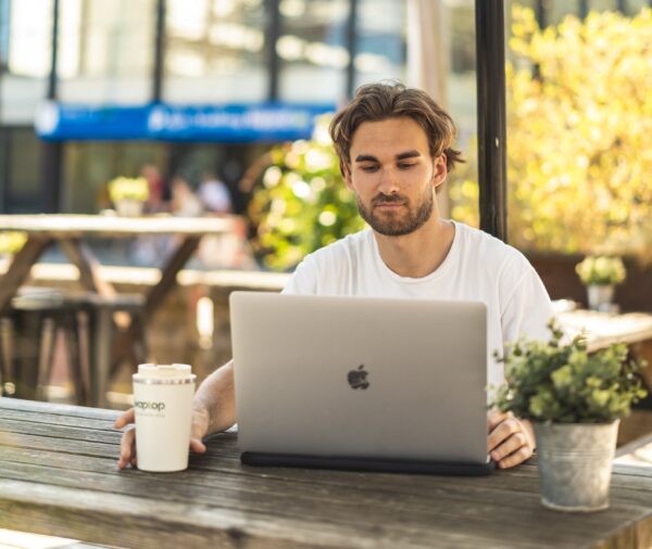 Apple-Macbook-Pro-16-Inch-Touchbar_Macbook-with-model-and-coffeemug-1
