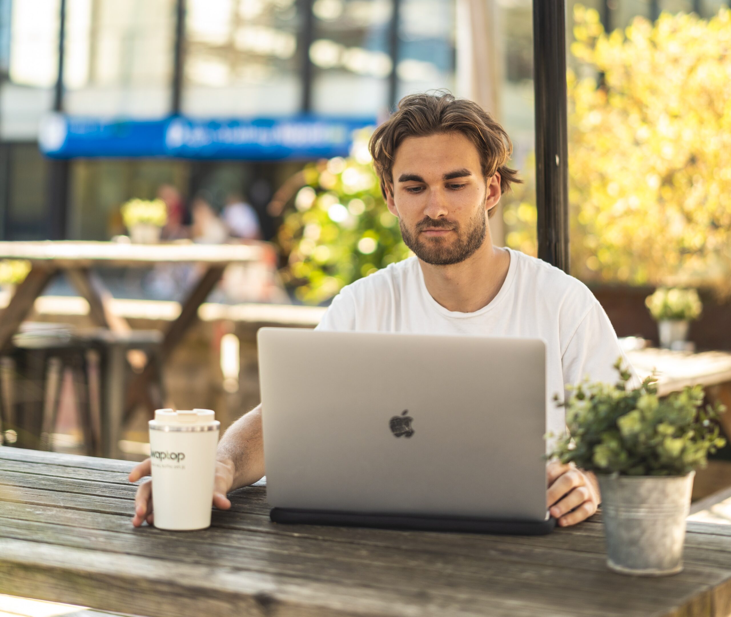 Apple-Macbook-Pro-16-Inch-Touchbar_Macbook-with-model-and-coffeemug-1